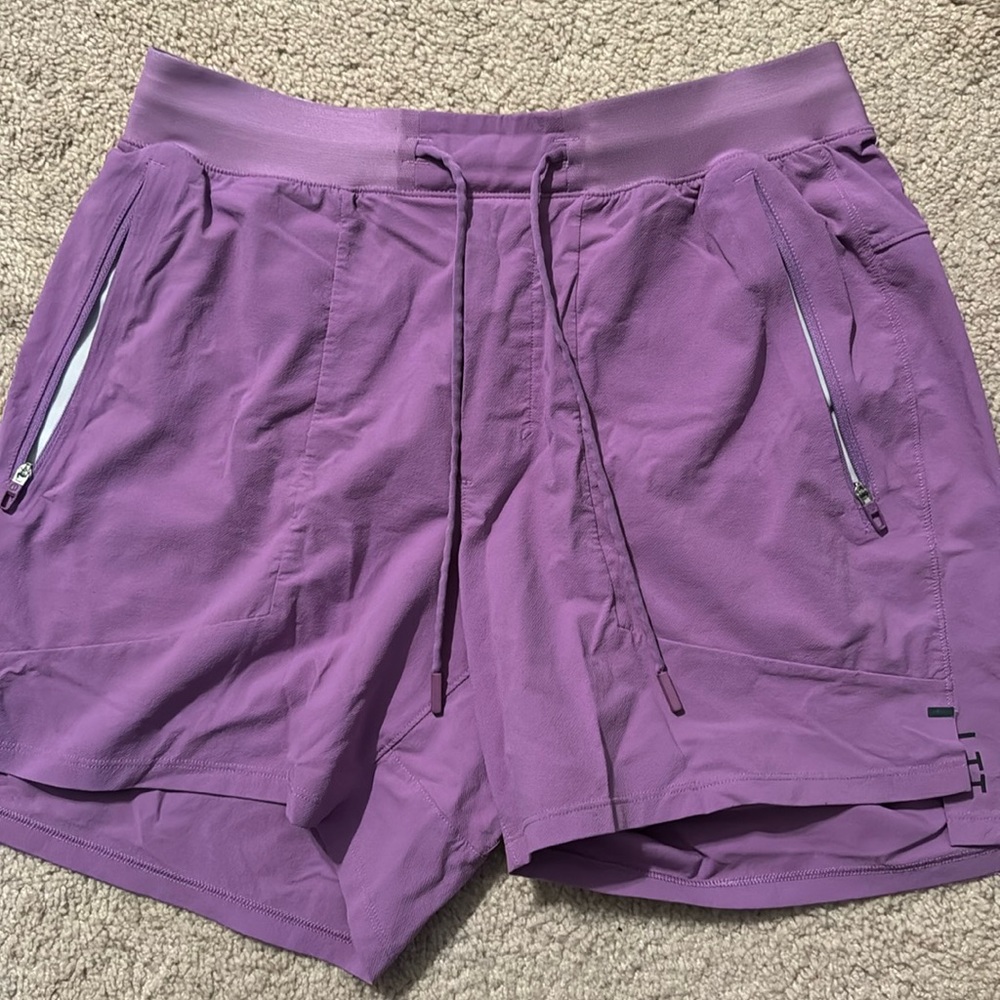 Excellent condition License to Train 5”. Size Medium. Purple